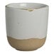 A round stoneware cup with a natural beige base and a white glazed upper half.