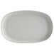 A light gray, irregular oval matte melamine coupe plate.