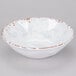 A white melamine bowl with an irregular shape and a subtle crackle pattern along the rim.