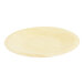 A round, light-colored birch wood plate.