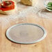 An 8-inch heavy duty expanded aluminum pizza screen.