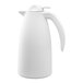 A white plastic insulated coffee server with a push-button lid and a curved handle.