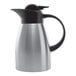 A stainless steel insulated coffee carafe with a black lid and handle.
