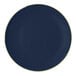 A navy round plastic plate with a gold band around the edge.