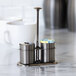 A stainless steel sugar stick holder and creamer set with a dark tungsten finish.