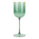 A green plastic wine goblet with a gold rim.