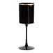 A black plastic wine goblet with a gold rim and a tall stem.