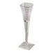 A clear, square-shaped plastic disposable champagne flute with a geometric base.
