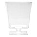 A clear, square-shaped disposable plastic wine glass with a pedestal base.