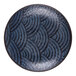 A round dark blue melamine plate with a textured, wavy geometric pattern.