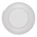 A round, light blue melamine plate with a slightly raised rim and a small notch on the edge.