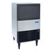 A compact undercounter ice machine with a built-in storage bin.