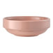 A round, coral-colored porcelain bowl with a stackable design.
