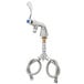 A T&S chrome deck-mounted faucet with flex inlets and wrist action handles.