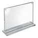 A clear acrylic magnetic block frame in landscape orientation with a rectangular acrylic base and rubber bumpers.