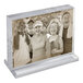 An acrylic block frame with a landscape orientation, displayed on a clear acrylic base.