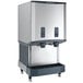 A stainless steel countertop nugget ice machine and water dispenser with push button dispensing and a 40 lb. bin capacity.