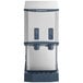 A countertop nugget ice machine and water dispenser with push button controls.