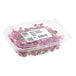 A clear plastic container filled with Fresh Origins Micro Dianthus edible flowers.