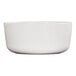 A large white round melamine serving bowl.