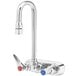A silver T&S wall mount workboard faucet with 2 gooseneck spouts and levers.