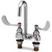 A T&S chrome deck mount medical faucet with gooseneck spout and wrist action handles.
