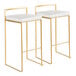 A pair of gold steel barstools with low backs and white faux leather seats.