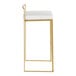A modern barstool with a gold steel frame and a white faux leather seat.