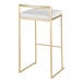 A modern barstool with a gold steel frame and a white faux leather seat.