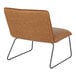 A camel-colored faux leather accent chair with a black steel frame.