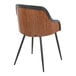 A modern arm chair with a walnut wood back, black faux leather trim, and black metal legs.