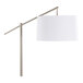 A brushed nickel floor lamp with an off-white linen drum shade.