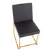 A black faux leather high back side chair with a gold brushed stainless steel frame.