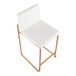 A counter height stool with a gold steel frame and a white faux leather seat and back.
