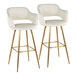 A pair of barstools with cream faux leather bucket seats, armrests, and gold metal legs.