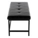 A black faux leather bench with a tufted seat and a black metal frame.