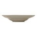 A round, sienna-colored porcelain deep coupe plate.