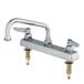A chrome T&S deck-mount faucet with two handles.