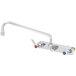 A T&S chrome wall mount faucet with two handles and a swing nozzle.