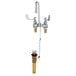 A chrome T&S deck mount medical faucet with gooseneck spout and wrist action handles.