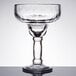 A close up of a clear Libbey Yucatan Margarita glass with a stem.