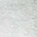 A close-up view of clear nugget ice pieces produced by a commercial ice machine.