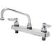 A silver T&S deck-mount faucet with two 4" wrist action handles.