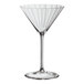 A clear, fluted 7.5 oz. martini glass with a long stem.