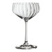 A clear Spiegelau Lifestyle 10.5 oz. coupe glass with a textured bowl and a long stem.