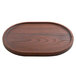 An oval dark brown ash wood rimmed serving board.