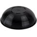 A black round ribbed plastic bowl turned upside down.