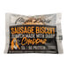 A packaged Mason Dixie sausage and sharp cheddar cheese biscuit breakfast sandwich.