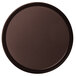 A brown round non-skid serving tray.