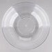 A large clear round ribbed plastic bowl.